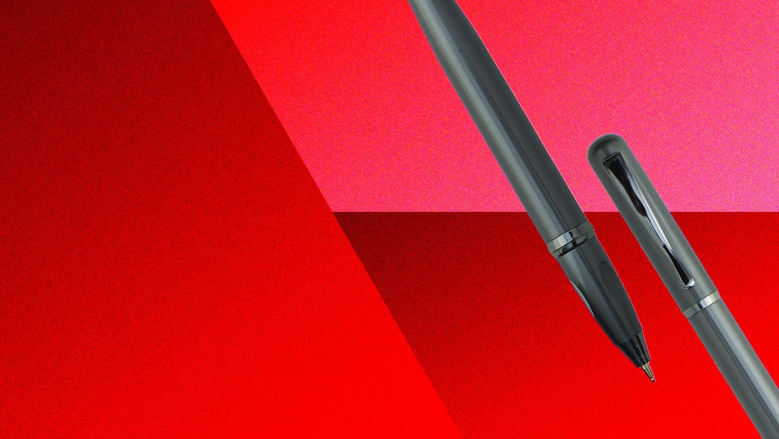 Two Swiss Armour pens in gunmetal finish on a red background